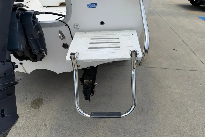Slide: The Image of 2005 McKee Craft Marathon 172 CC boat ladder and platform on concrete surface. - 5