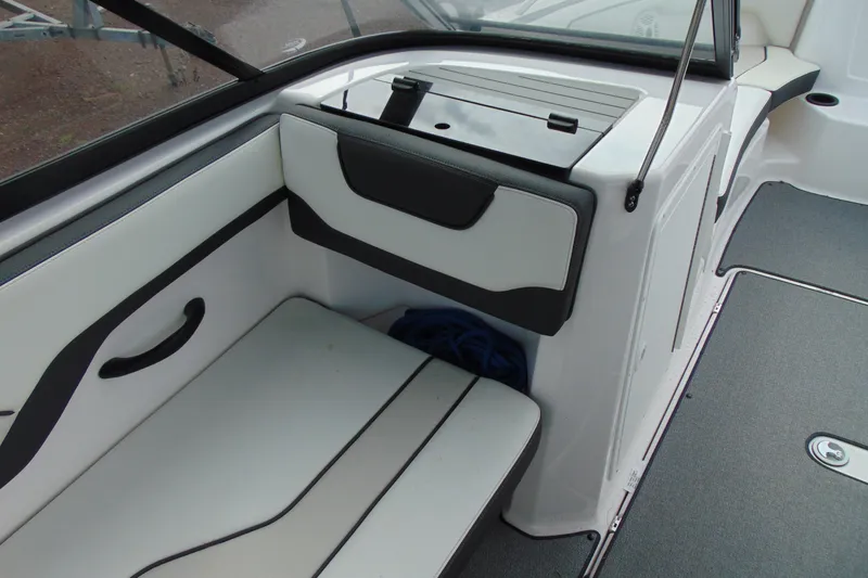 Slide: The Image of Interior seating and storage area of a 2018 Yamaha SX210 boat. - 11