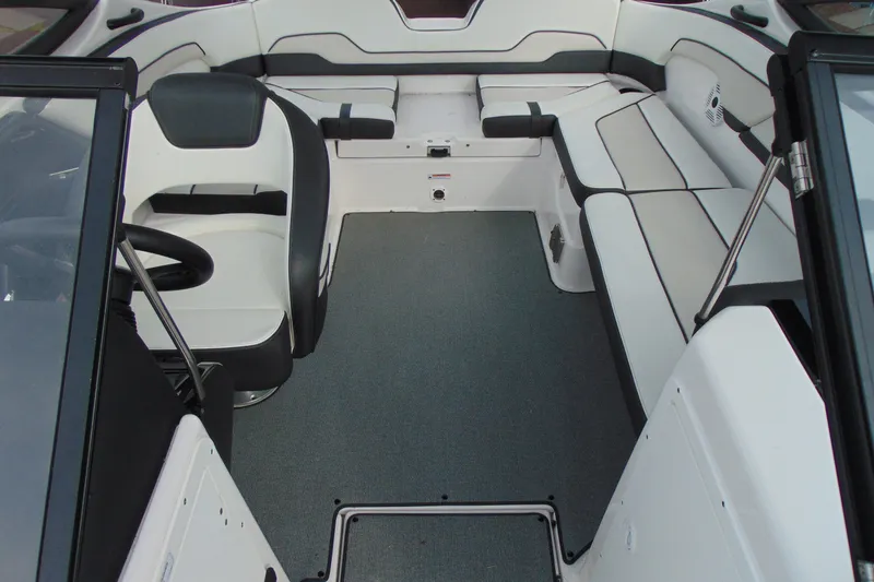 Slide: The Image of 2018 Yamaha Boats SX210 interior with seating and steering wheel. - 13