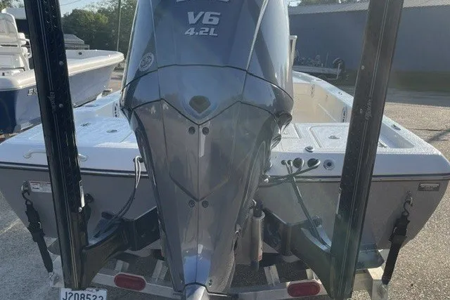 Slide: The Image of 2024 Skeeter SX241 boat with V6 4.2L engine, rear view on trailer. - 5