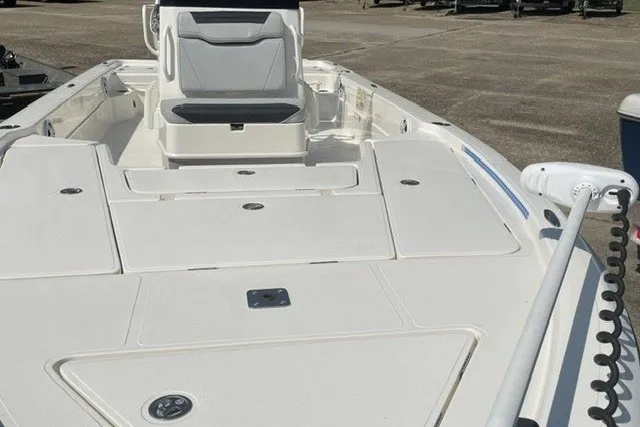 Slide: The Image of 2024 Skeeter SX241 boat with spacious deck and modern seating, ideal for fishing and leisure. - 2