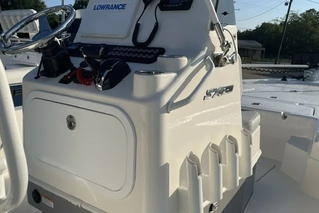 Slide: The Image of 2024 Skeeter SX241 boat console with Lowrance electronics and storage compartments. - 6