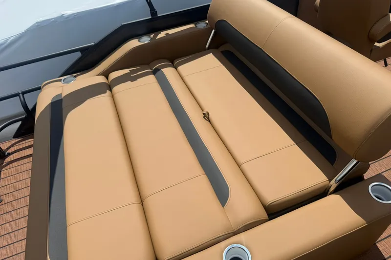 Slide: The Image of 2026 Bentley Pontoons Legacy 223 Swingback with luxurious tan seating and cup holders. - 13