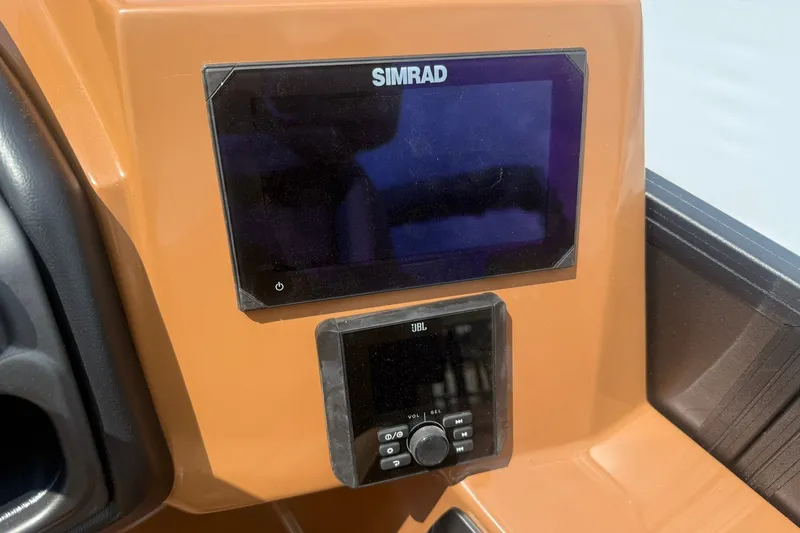 Slide: The Image of Simrad and JBL displays on 2026 Bentley Pontoons Legacy 223 Swingback dashboard. - 9