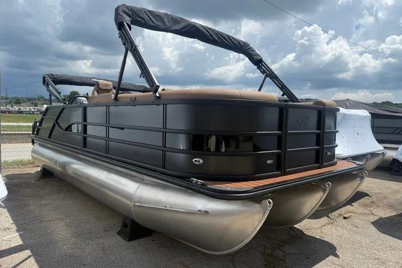 The Image of 2026 Bentley Pontoons Legacy 223 Swingback, sleek black design, parked outdoors under cloudy sky. - 3