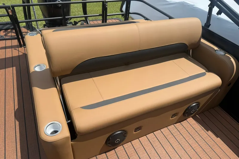 Slide: The Image of 2026 Bentley Pontoons Legacy 223 Swingback with tan seating and integrated cup holders. - 12