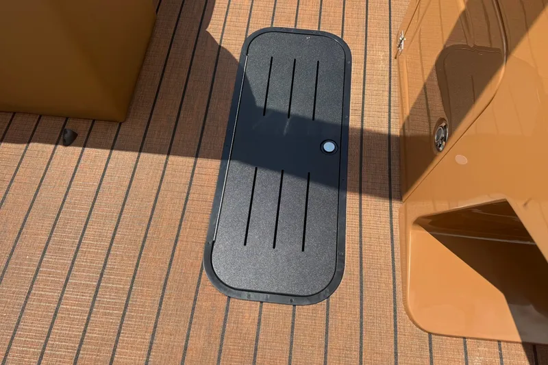 Slide: The Image of Deck of 2026 Bentley Pontoons Legacy 223 Swingback with storage hatch. - 15