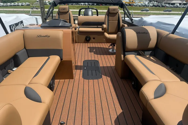 Slide: The Image of 2026 Bentley Pontoons Legacy 223 Swingback interior with luxurious tan seating and sleek design. - 6