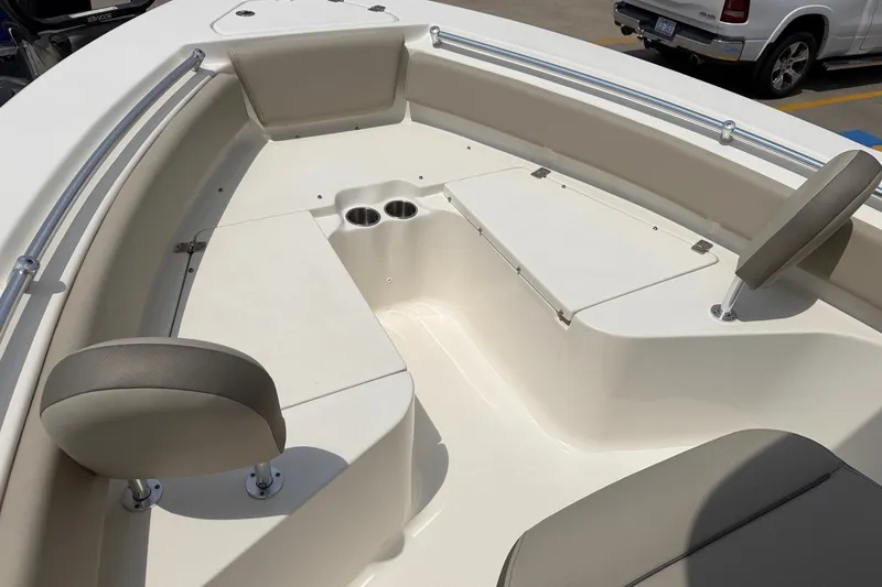Slide: The Image of 2023 Key West 219 FS boat interior with seating and cup holders. - 15