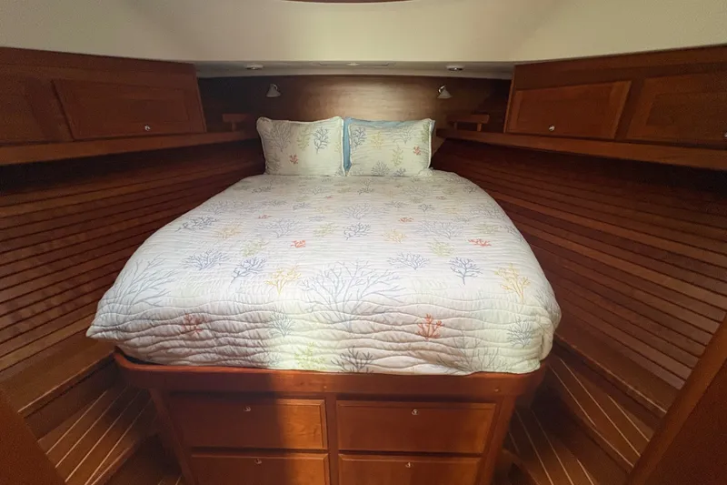 Slide: The Image of Cozy cabin bedroom in 2015 Sabre 38 Salon Express yacht with wooden interior. - 33