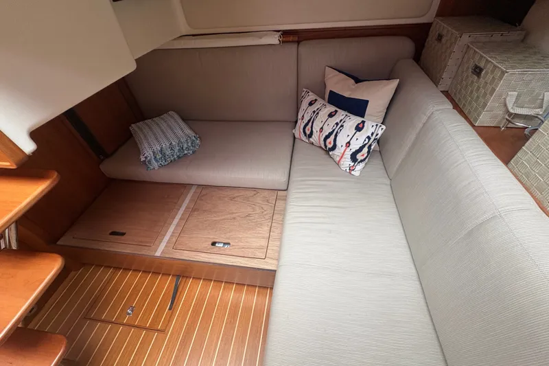 Slide: The Image of Interior of 2015 Sabre 38 Salon Express with cozy seating and decorative pillows. - 27