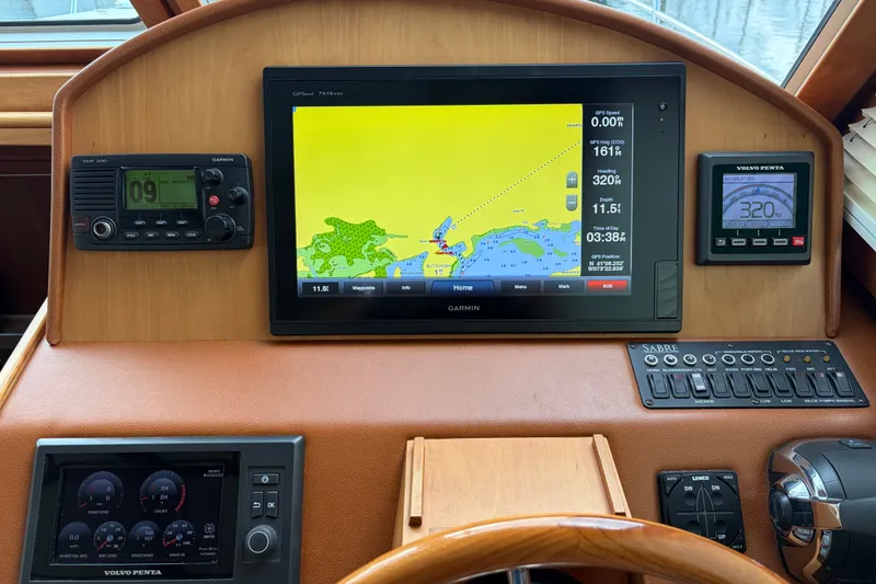 Slide: The Image of Dashboard of 2015 Sabre 38 Salon Express with navigation and control systems. - 41