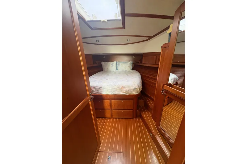 Slide: The Image of 2015 Sabre 38 Salon Express cabin with wooden interior and cozy bed. - 32