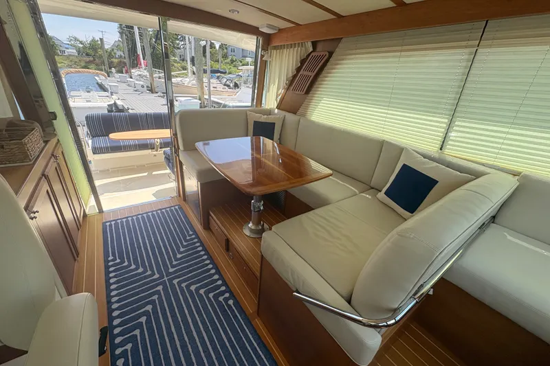 Slide: The Image of Luxurious interior of 2015 Sabre 38 Salon Express yacht with elegant seating and wooden table. - 17