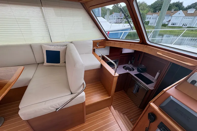 Slide: The Image of Interior of 2015 Sabre 38 Salon Express yacht with seating and kitchenette. - 23