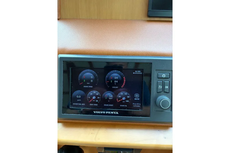 Slide: The Image of Volvo Penta engine display on 2015 Sabre 38 Salon Express yacht dashboard. - 45