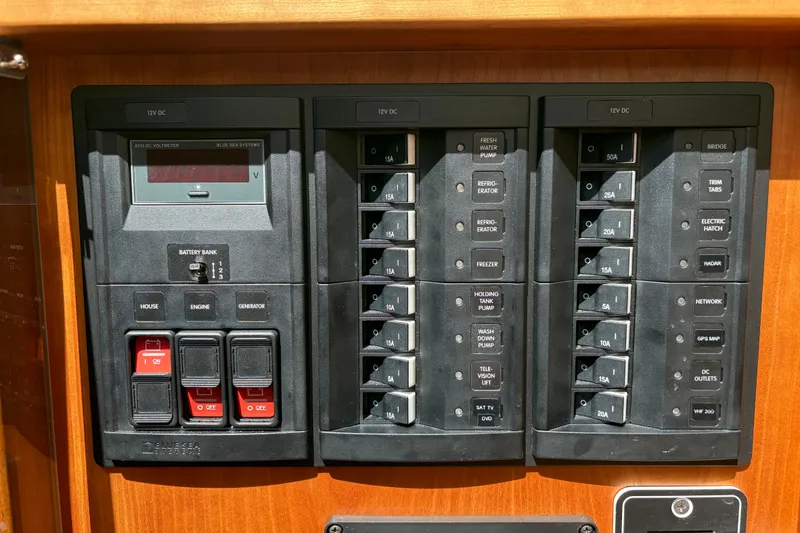 Slide: The Image of Electrical panel of 2015 Sabre 38 Salon Express yacht with switches and voltmeter. - 49