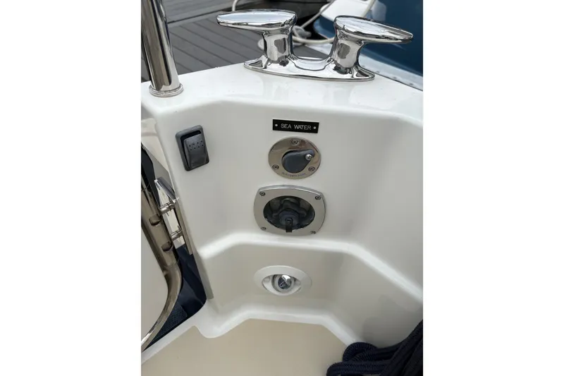Slide: The Image of 2015 Sabre 38 Salon Express sea water connection and cleat detail. - 13