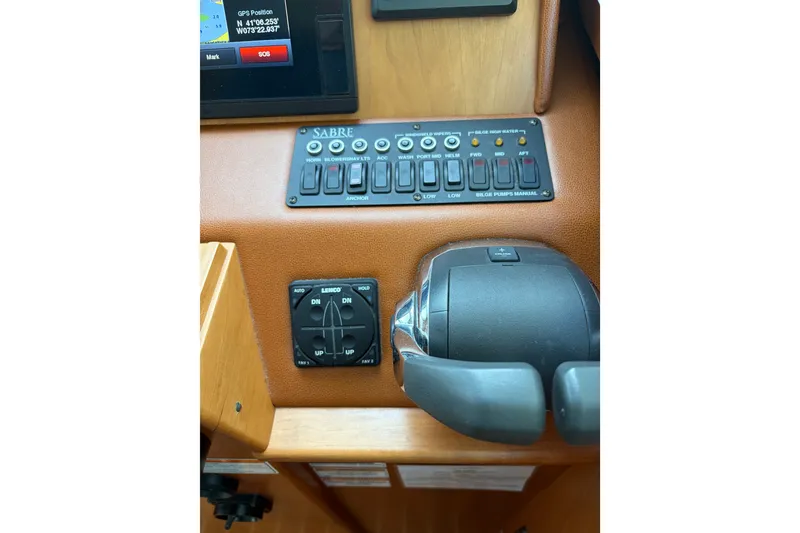 Slide: The Image of Control panel of a 2015 Sabre 38 Salon Express yacht with switches and throttle. - 48