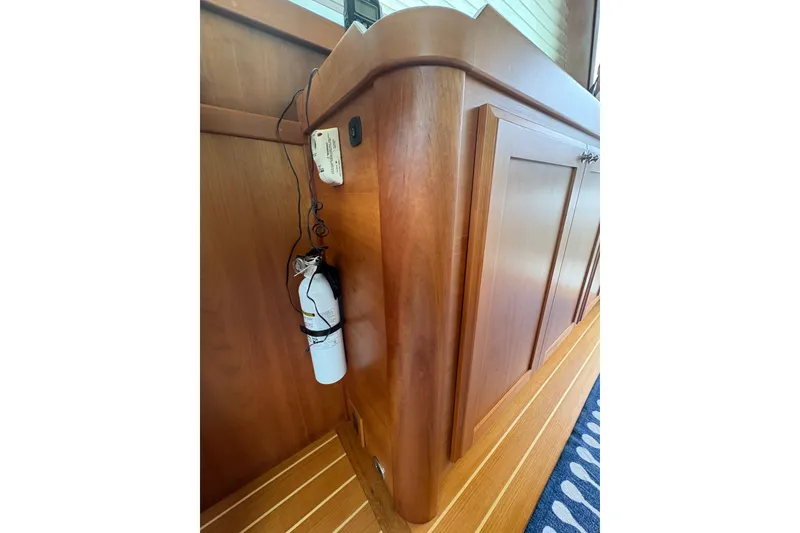 Slide: The Image of Wooden interior of 2015 Sabre 38 Salon Express with fire extinguisher and wiring. - 21