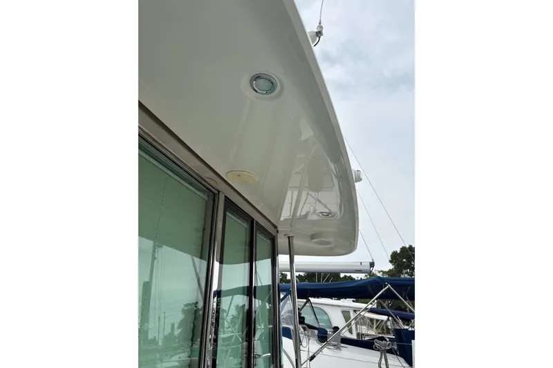 Slide: The Image of 2015 Sabre 38 Salon Express yacht exterior with sleek design and modern features. - 14