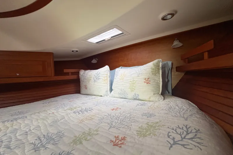 Slide: The Image of Cozy cabin interior of 2015 Sabre 38 Salon Express with nautical-themed bedding. - 34