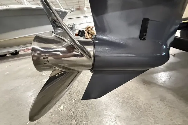 Slide: The Image of Close-up of a 2023 Rossiter 23 boat propeller in a showroom setting. - 20