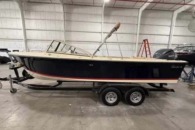 The Image of 2023 Rossiter 23 boat on trailer in indoor storage facility. - 0