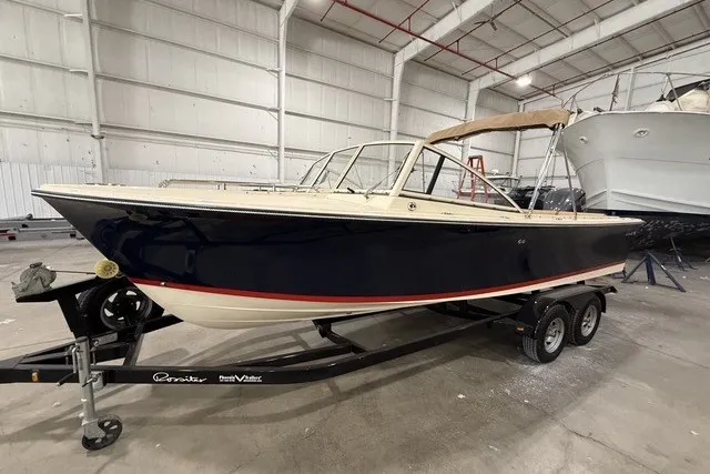 Slide: The Image of 2023 Rossiter 23 boat on trailer in indoor storage facility. - 3
