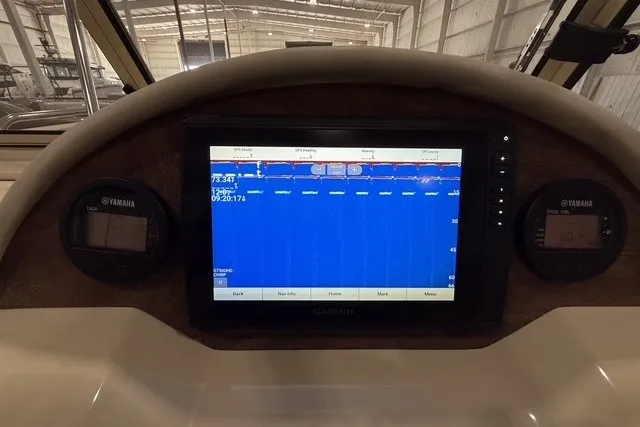 Slide: The Image of Dashboard of a 2023 Rossiter 23 boat with Garmin navigation display. - 14