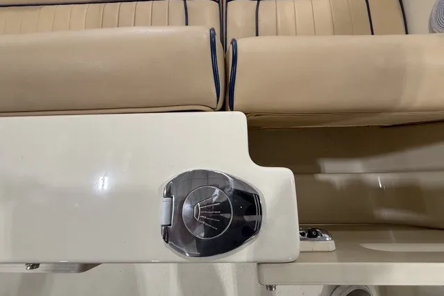 Slide: The Image of 2023 Rossiter 23 boat interior with beige seating and chrome details. - 19