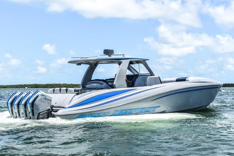 The Image of A modern speedboat with four outboard engines cruising on the water. - 0