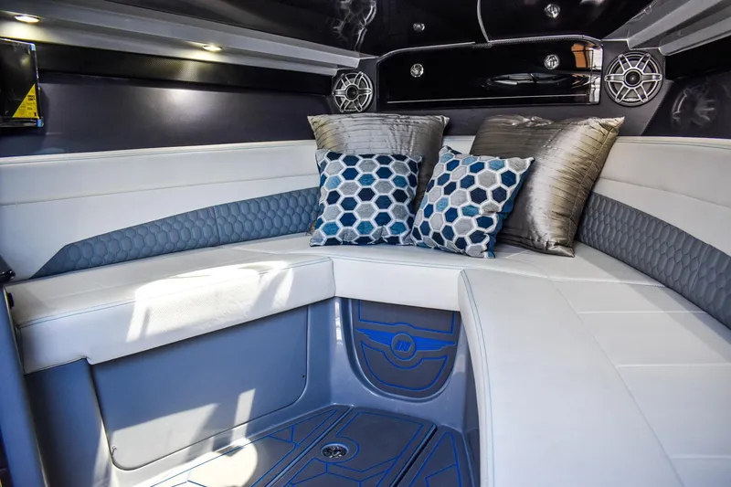 Slide: The Image of The 2022 Deep Impact 399 Forward Cabin features stylish upholstery and modern speakers. - 18