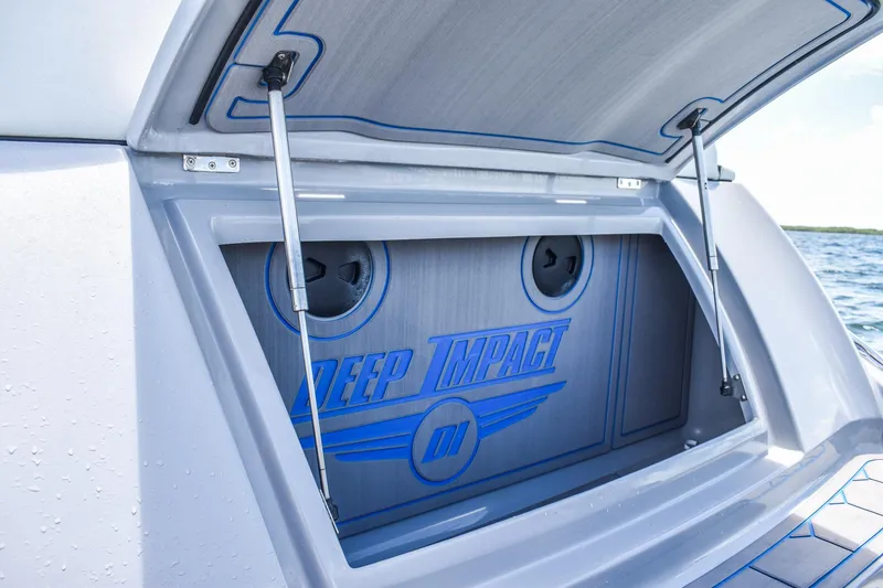 Slide: The Image of The 2022 Deep Impact 399 Forward Cabin storage compartment is open, displaying the logo. - 21