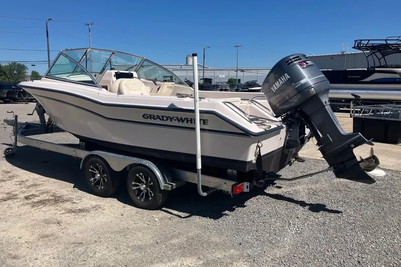 Slide: The Image of 1998 Grady-White Tournament 192 boat on trailer with Yamaha outboard motor. - 2