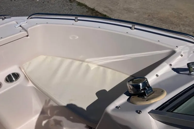 Slide: The Image of 1998 Grady-White Tournament 192 boat interior with seating and cup holder. - 18