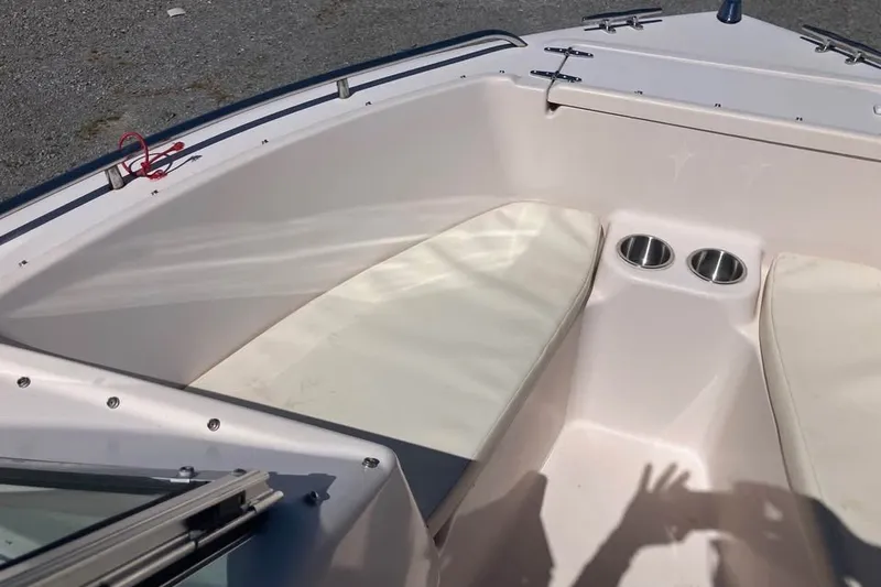 Slide: The Image of 1998 Grady-White Tournament 192 boat interior with seating and cup holders. - 17