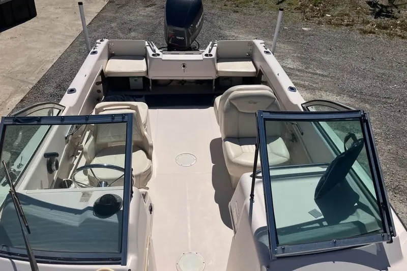 Slide: The Image of 1998 Grady-White Tournament 192 boat interior with seating and steering wheel. - 8