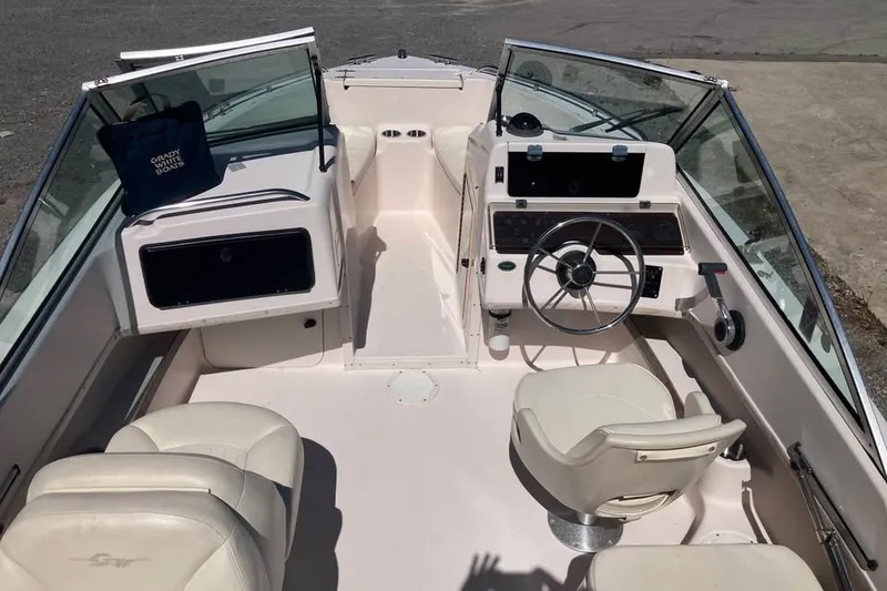 Slide: The Image of 1998 Grady-White Tournament 192 boat interior with steering wheel and seating. - 9