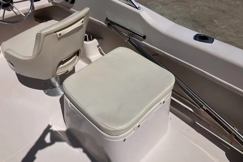 Slide: The Image of 1998 Grady-White Tournament 192 boat interior with seating and steering wheel. - 16