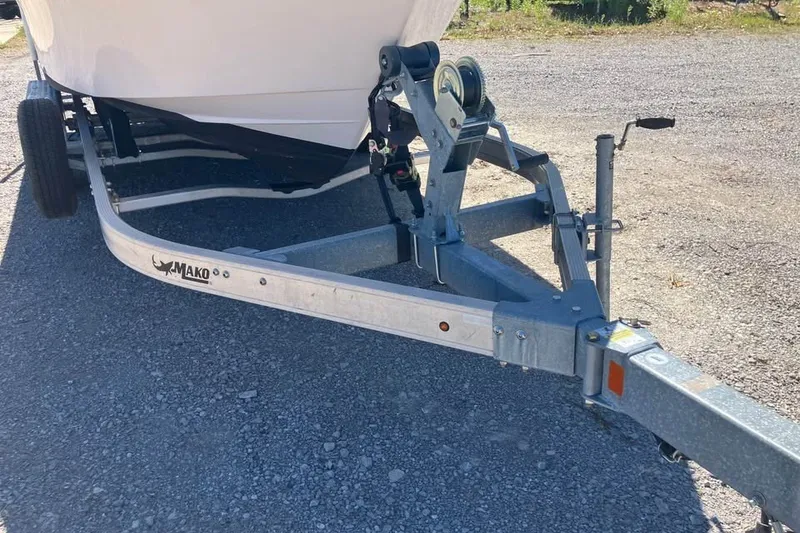 Slide: The Image of 1998 Grady-White Tournament 192 boat on Mako trailer, parked on gravel. - 6