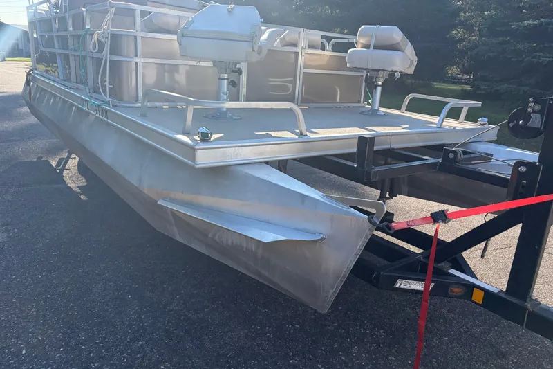 The Image of 1984 Ercoa Captain 21 pontoon boat on trailer, featuring aluminum construction and seating. - 0