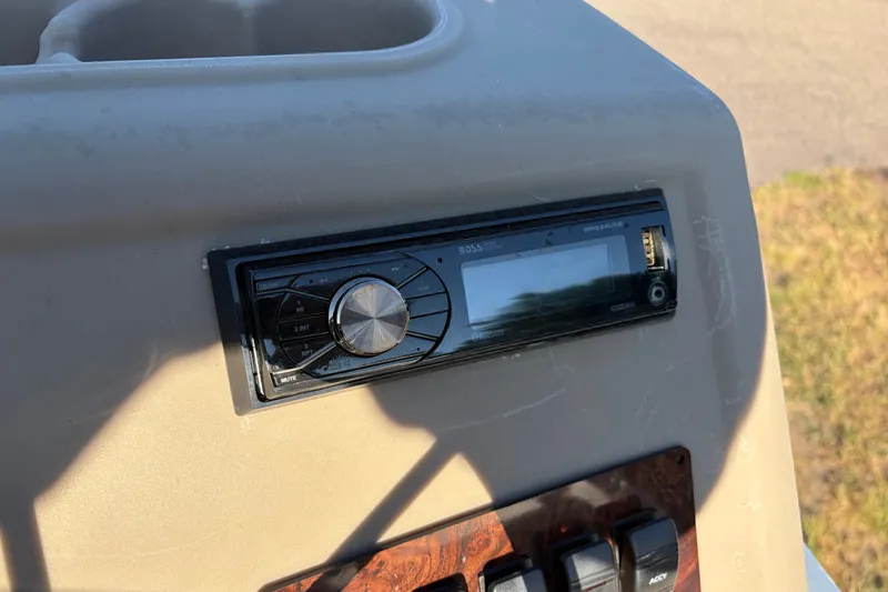 Slide: The Image of 1984 Ercoa Captain 21 boat dashboard with a Boss audio system installed. - 7