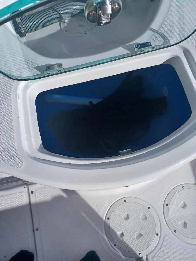 Slide: The Image of Livewell on 2022 Everglades 243 Center Console boat, open lid view. - 20