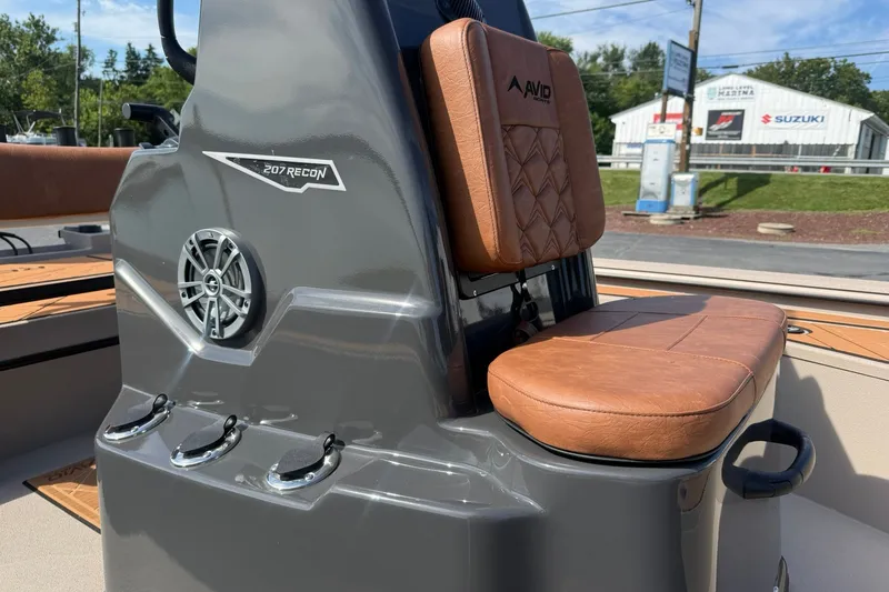 Slide: The Image of 2027 Avid 207 Recon boat seat with brown leather upholstery and speaker detail. - 11