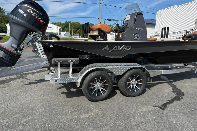 Slide: The Image of Avid 207 Recon boat with Yamaha engine on a dual-axle trailer, 2027 model. - 7