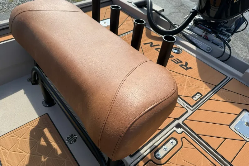 Slide: The Image of Avid 207 Recon boat interior with tan leather seat and rod holders, 2027 model. - 12