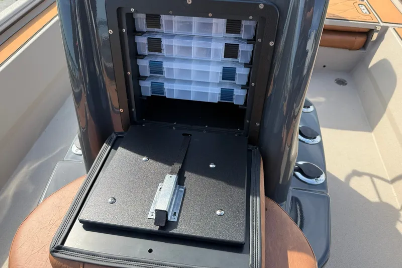 Slide: The Image of Storage compartment with tackle boxes on Avid 207 Recon boat, 2027 model. - 18