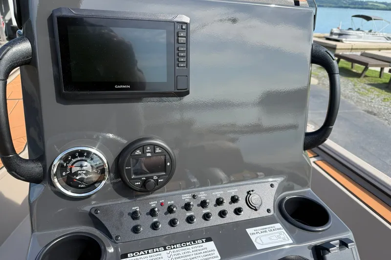 Slide: The Image of Control panel of Avid 207 Recon 2027 boat with Garmin display and gauges. - 14