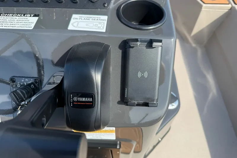 Slide: The Image of Control panel of Avid 207 Recon 2027 boat with Yamaha remote and wireless charger. - 15